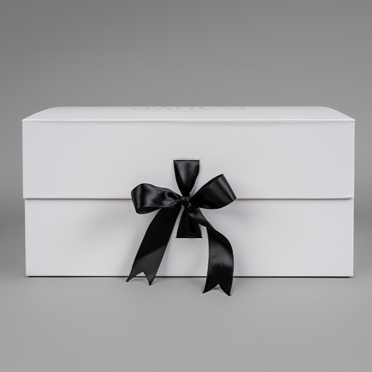 The Arrival Box premium dog gift box with black bow